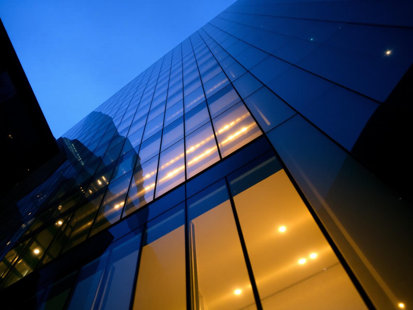 Modern glass office tower at blue hour in Washington DC